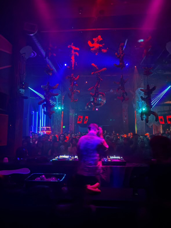 View from behind the decks toward the crowd and forms